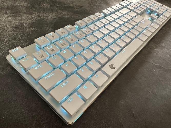 Hands typing on slim office keyboard