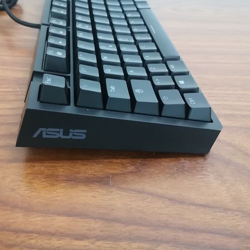 Black mechanical keyboard with vibrant red backlight during use