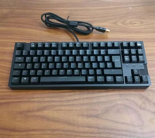 Close-up of red illuminated gaming keyboard keys in action