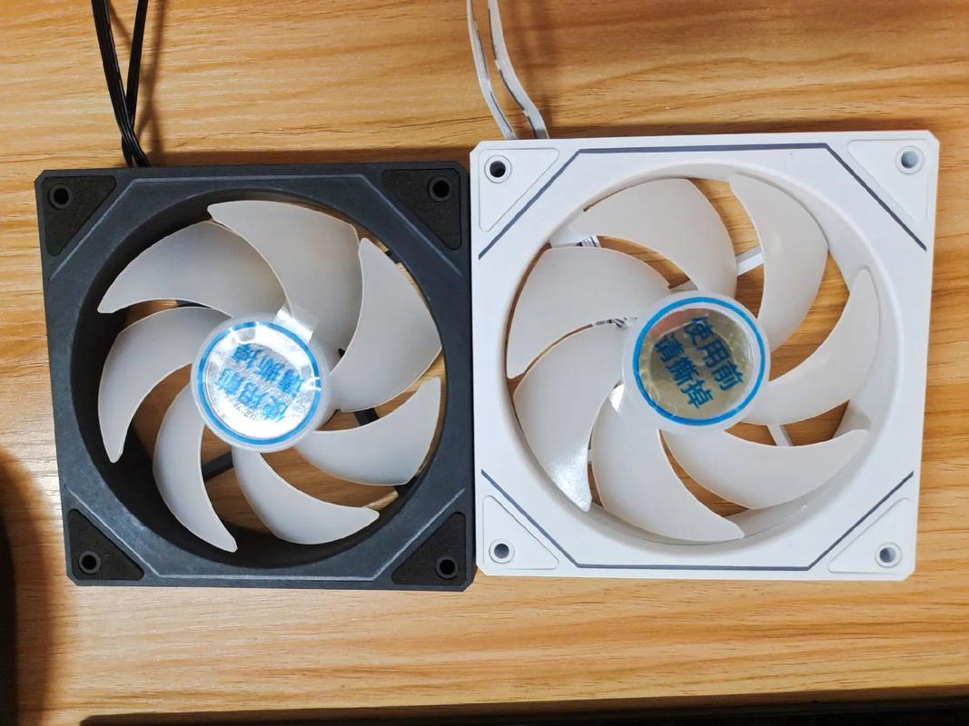 Close-up of white PC components with glowing ARGB fans