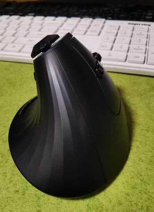 Programmer using wireless mouse at desk