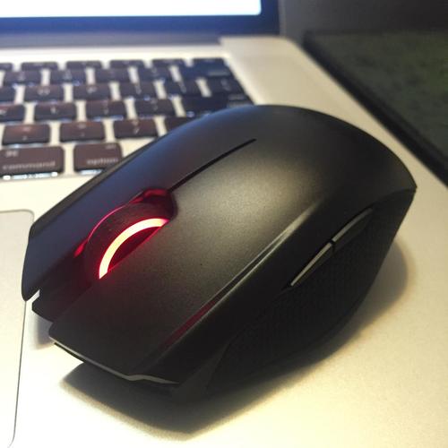 Black computer mouse on white background highlighting compact power design