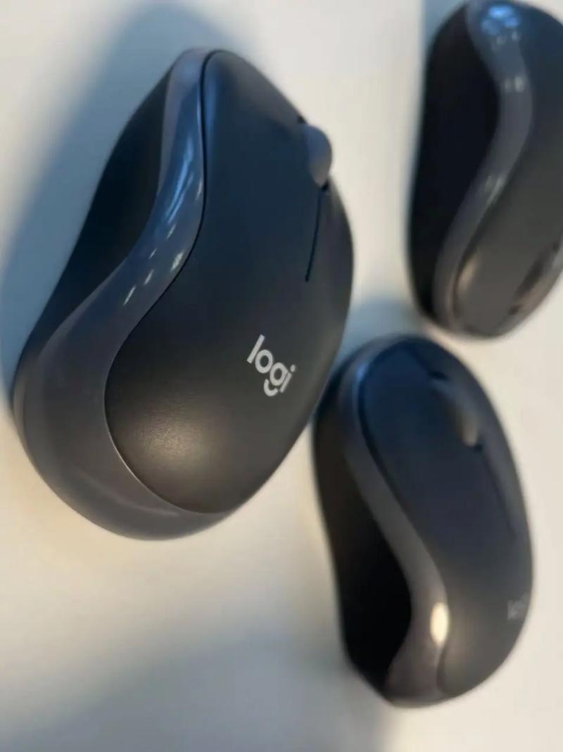 Silver wireless mouse on wooden table