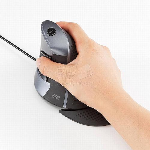 Black ergonomic mouse against dark background