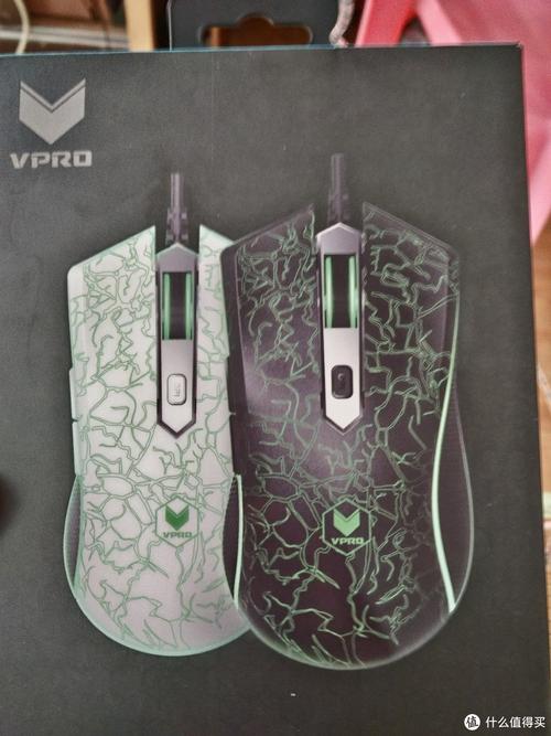 Black gaming mouse on pink background