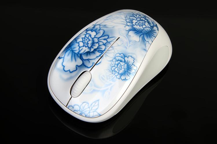 Person using computer mouse on desk