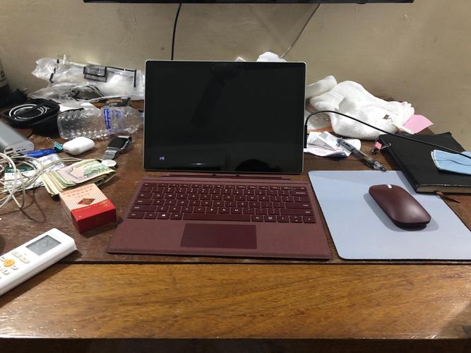 Tech workspace with mouse in action