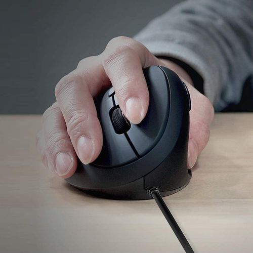 Person using ergonomic mouse at desk