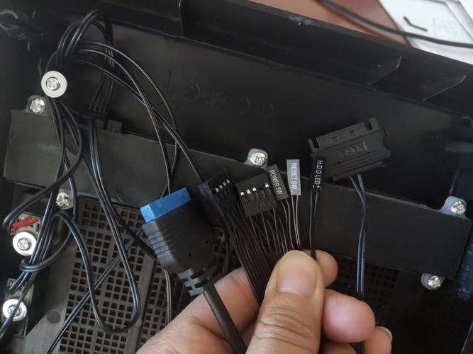 Black PC case interior with fans and hardware components