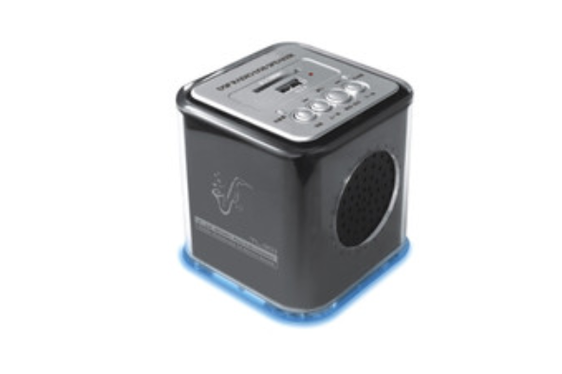 Desktop speaker playing audio on table