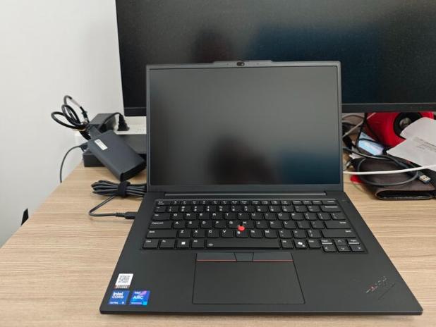 Computer monitor with keyboard in workspace