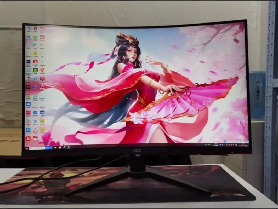 Black curved monitor on ergonomic stand