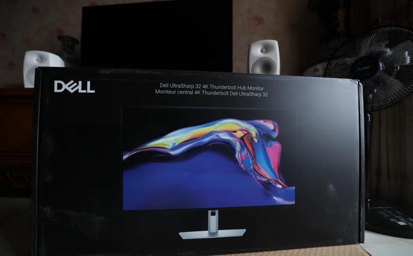 Modern monitor on desk with clean power setup