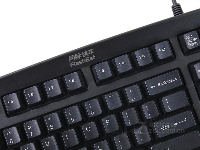 Minimalist black mechanical keyboard on dark wooden surface