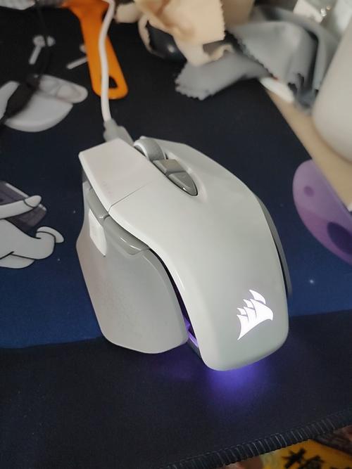 Gaming mouse close-up on desk with RGB lighting