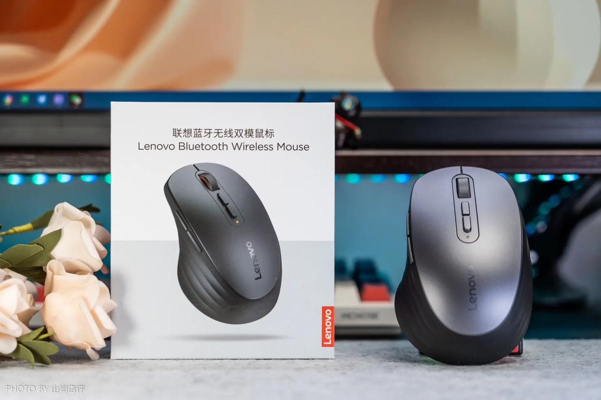 Modern wireless mouse on desk showcasing sleek white design
