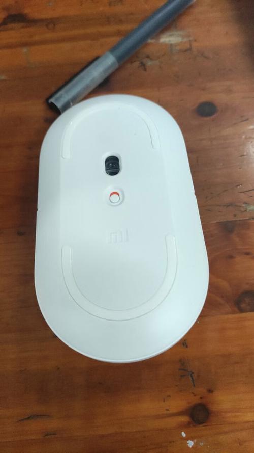 Black wireless mouse on white background