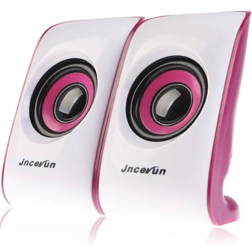 蓝白便携音箱摆放在笔记本旁