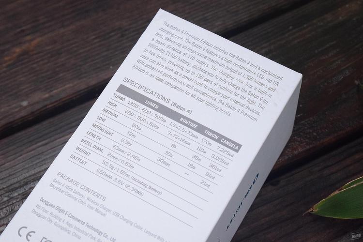 Person choosing between different tech gadgets on a table