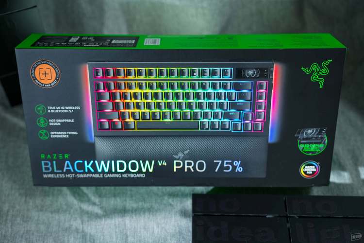 Person typing on a mechanical keyboard in a gaming setup