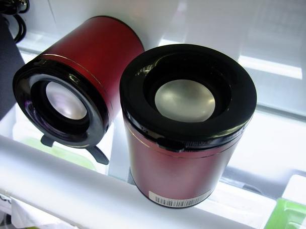 Person listening to desktop speakers