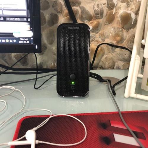 Minimalist tech setup with small audio device