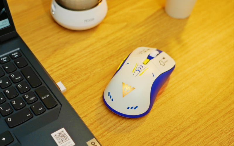 Hand holding wireless gaming mouse highlighting ergonomic specs