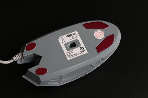 Bottom view of gaming mouse highlighting feet and build quality