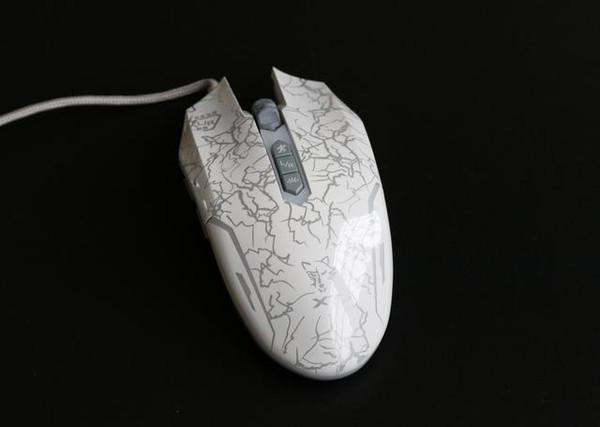 Gaming mouse bottom view showing sensor and feet