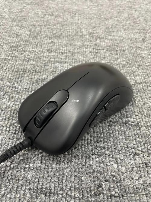 Black gaming mouse close-up on desk