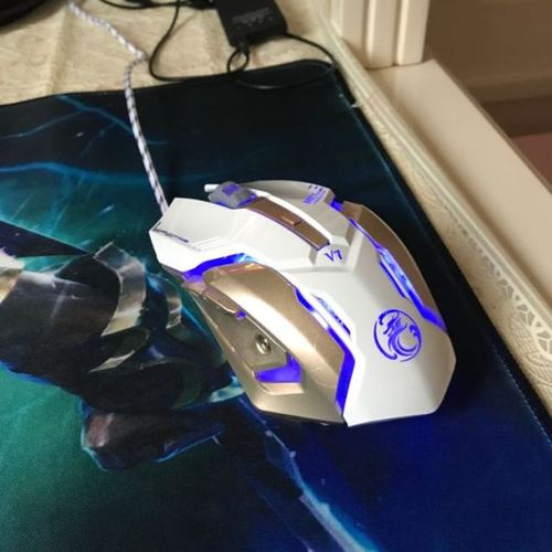Gamer using RGB gaming mouse in action