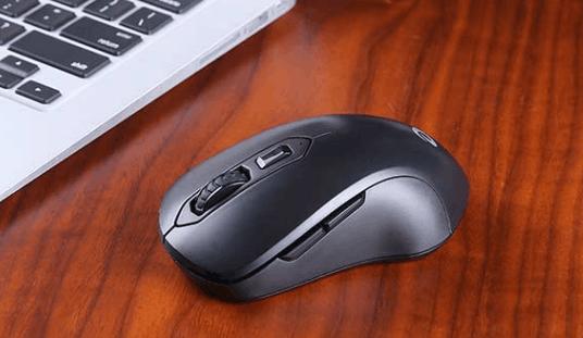Hand holding wireless computer mouse