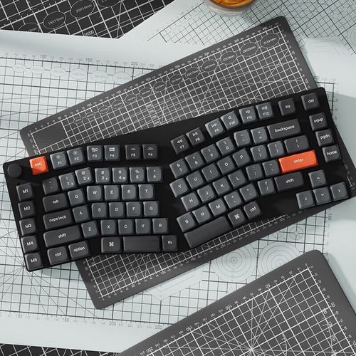 Hands typing on mechanical keyboard