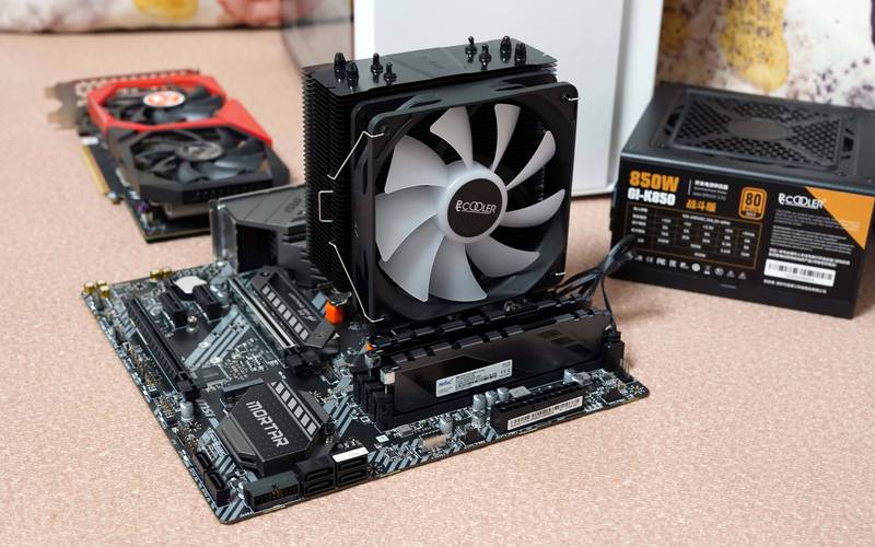 CPU cooler hardware on yellow surface
