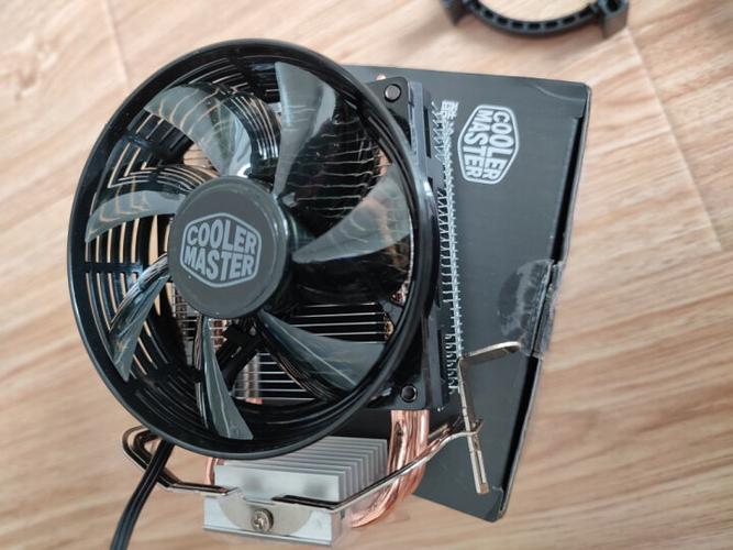 CPU air cooler with fan on yellow background