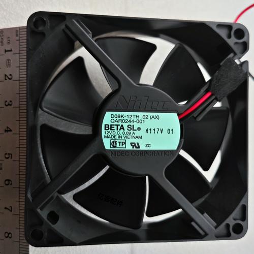 Computer cooling fan hardware on yellow background