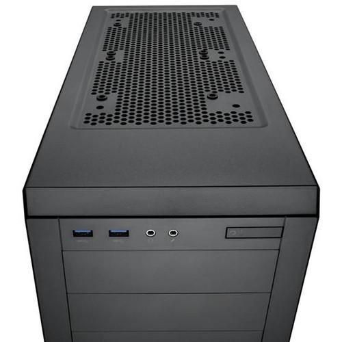 Black computer tower in dark environment