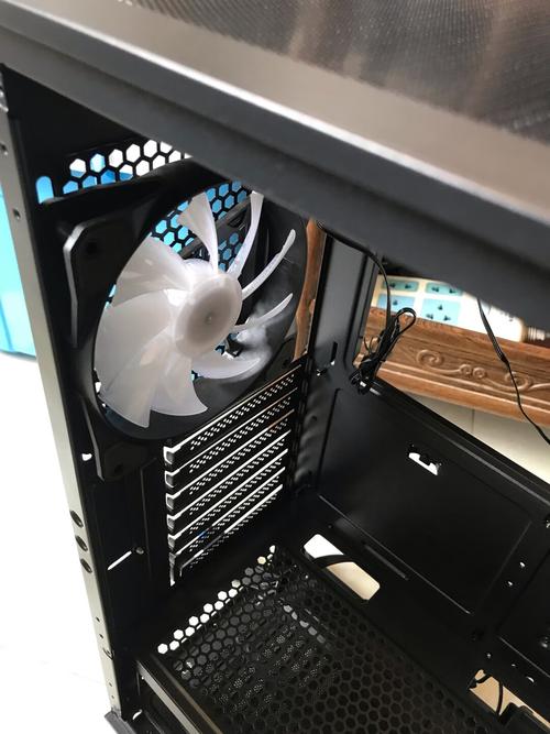 Sleek PC case on desk with RGB lighting