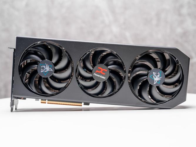 White graphics card with three cooling fans in action
