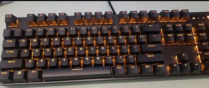 Keyboard in active office workspace