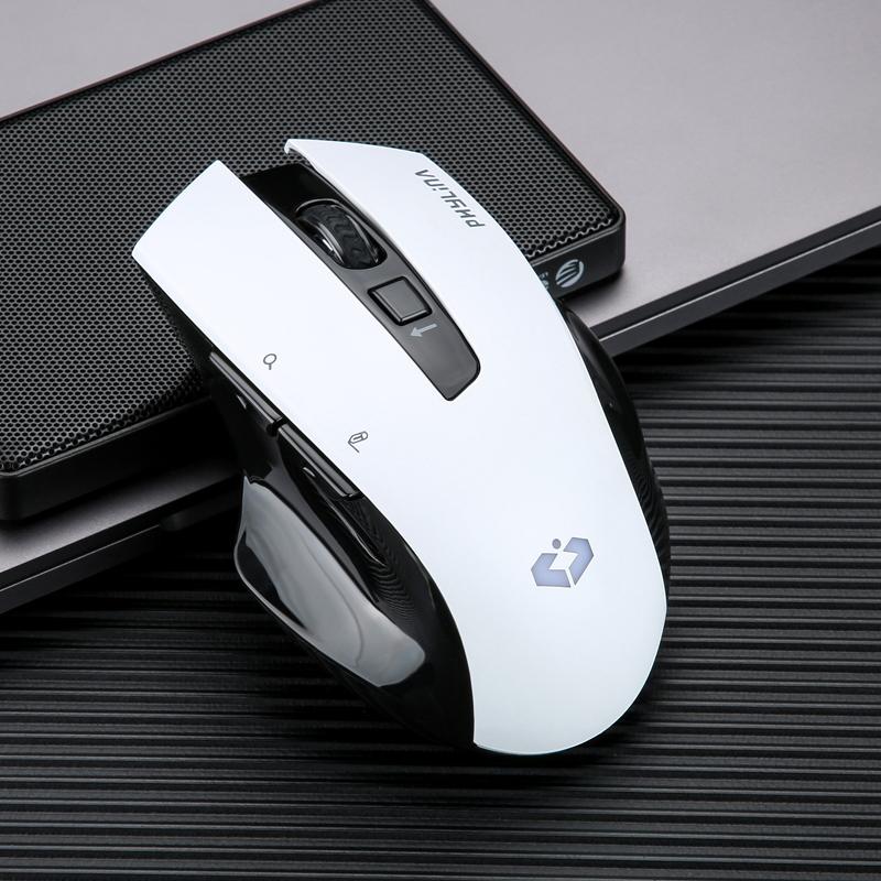 Gaming mouse on desk with keyboard