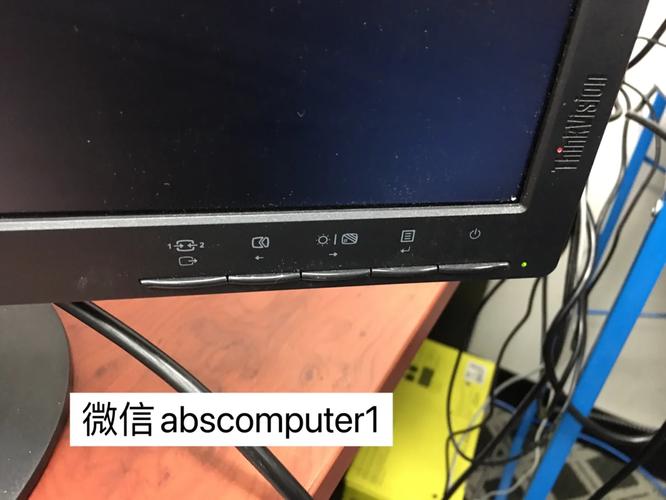 Person working on computer monitor in office