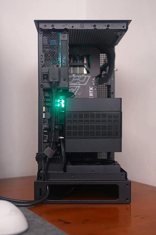 Black compact PC case on desk