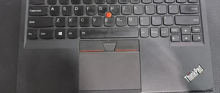 AAA batteries next to keyboard