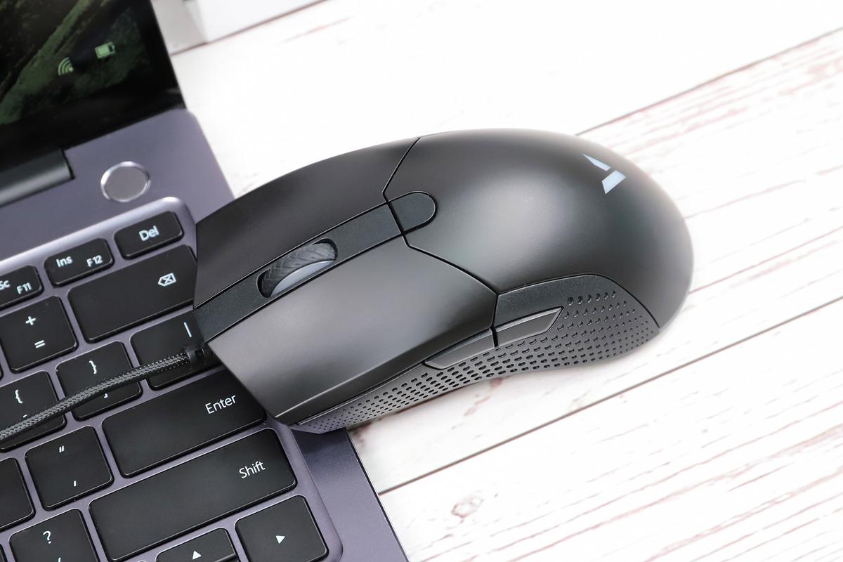 Ergonomic gaming mouse on desk
