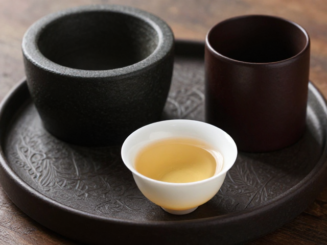 茶碾盘与茶筒的古法意蕴