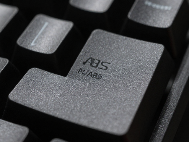 电竞ABS键帽工艺,识别防滑处理与早期PC/ABS混合应用解析