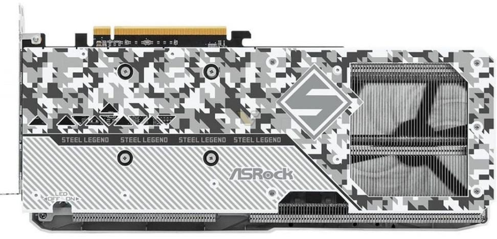 Hand holding a credit card near a laptop, symbolizing purchase decision