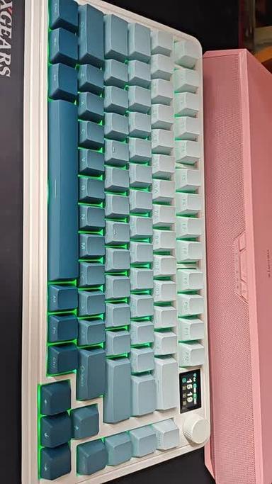 Person choosing between different keyboards on a desk