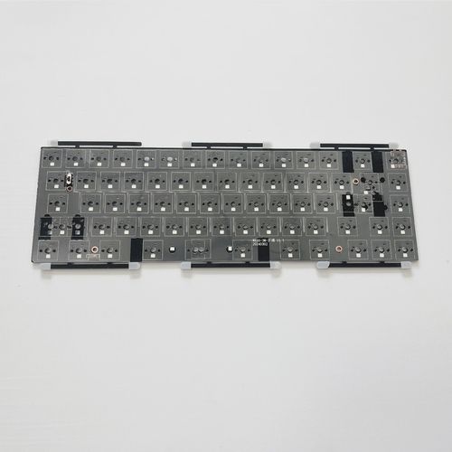 A person typing on a keyboard with focus on hands and keycaps